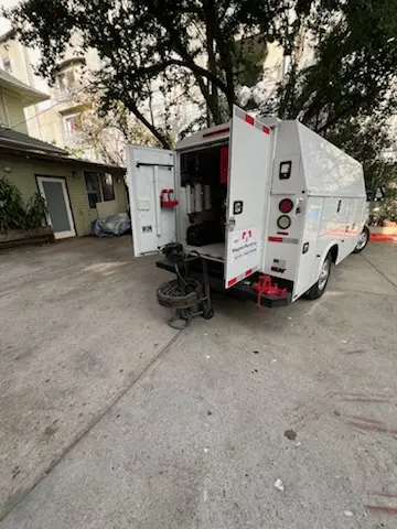 Magnet Plumbing service vehicle on-site for Grease Trap Cleaning in William Dunlap Homes